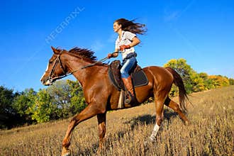 Girl riding a horse