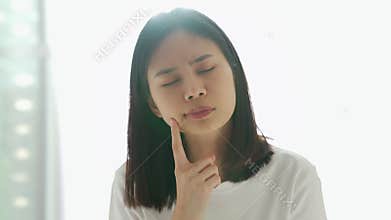 Young Asian woman thinking have idea and pondering inspiration