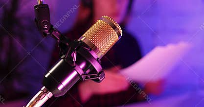 Recording podcast - podcaster radio station host working in studio. microphone closeup