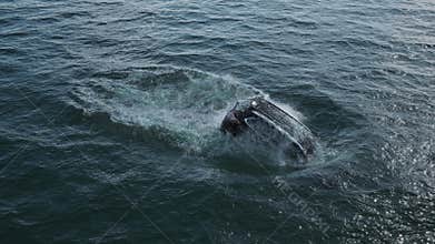 Black car falls and drowning in water