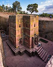 Lalibela, Ethiopia - Feb 13, 2020: Ethiopian people at the famous Rock-Hewn Church of Saint George - Bete Giyorgis