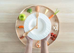 Intermittent fasting IF diet concept with 8-hour clock timer for eating nutritional or keto low carb, high fat and protien