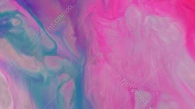 Close-up blurry blue and pink vibrant oil paints blend together