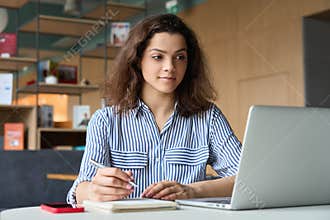 Hispanic girl student using laptop watching distance online seminar class.