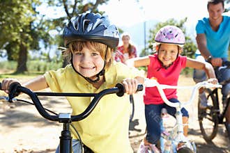 Family riding bikes having fun