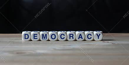 Democracy politics word on wood