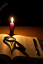 Bible and magnifier searching of god