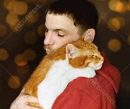 Man and his ginger white cat, love and friendship