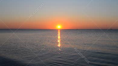 Sunrise sunsets at sea. Summer sunset dawn seascape.