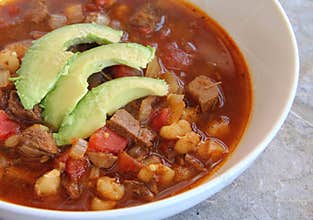Beef Hominy Soup with Avocado Garnish.