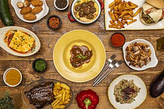 Delicious combination of dishes of Spanish gastronomy and Italian food. BBQ ribs, risotto, pork cheek, pork rinds, ham croquettes