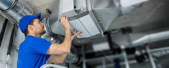 Ventilation system installation and repair service. hvac technician at work. copy space