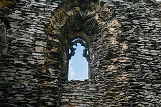 Medieval gothic castle Bezdez, royal palace, grey stone ruin on hill at sunny day, ancient fortress, fairytale stronghold, arched