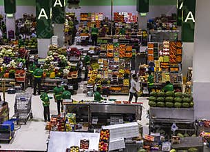 Dubai, UAE - 07.07.2021 - Customers and vendors at Waterfront market, fruits and vegetables section. Market