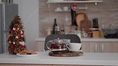 Empty xmas decorated culinary kitchen with nobody in it ready for christmas holiday