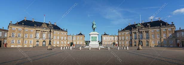 Panoramic view of Amalienborg Palace and Frederick V Statue with a blue sky - Copenhagen, Denmark