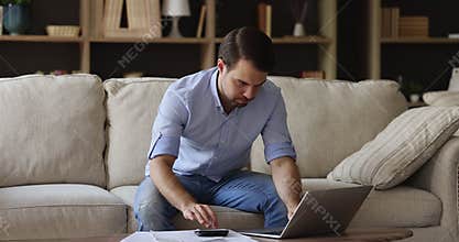 Worried young man do accounting deal with business bankruptcy