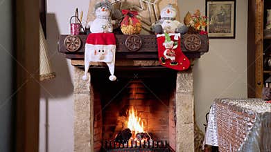 Burning fireplace, real wood logs, cozy warm home at xmas time