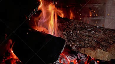 Burning fireplace, real wood logs, cozy warm home at xmas time