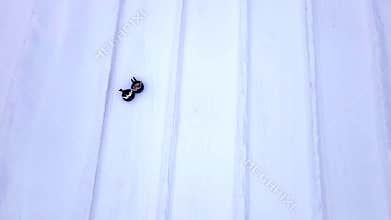 families having fun at snow tubing park