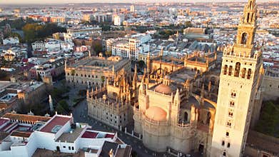 Catedral de Sevilla. Drone shot of the beautiful Spanish city of Seville at the sunrise, UHD, 4K