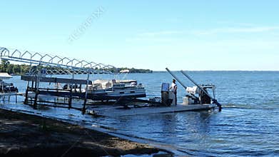 POPE CO, MN - 23 SEP 2021: Boat dock hauled to shore and placed on beach.