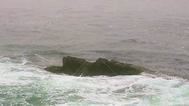 Waves Crash Over Rock on Atlantic Coast