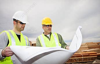 Workers Reading Construction Plans
