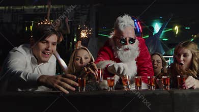 Happy people, Santa Claus drink alcohol at club bar, New Year celebration party