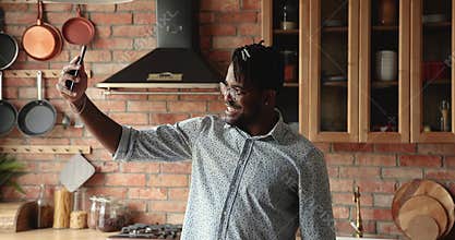 African guy enjoy video call conversation with girlfriend
