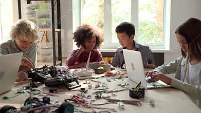 Group of multiracial schoolkids in classroom on science engineer education.