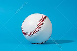 Baseball ball on blue background in perspective