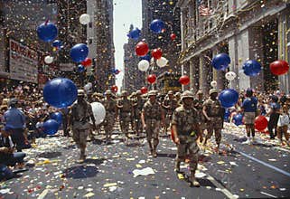 Soldiers marching in ticker tape parade, NY
