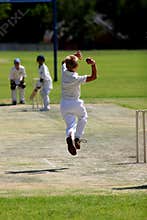Young man bowling cricket ball