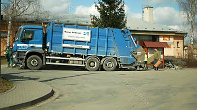 OLOMOUC, CZECH REPUBLIC, FEBRUARY 24, 2021: Garbage truck waste crushing rubbish collection detail large machine wood