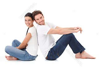 Cheerful couple smiling happily on floor