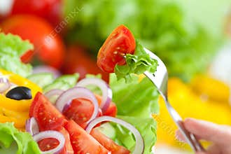 Healthy food fresh vegetable salad and fork