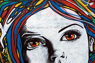 Modern style graffiti on brick wall