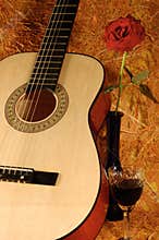 Guitar, rose, wine