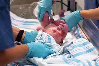 Newborn baby moments after birth
