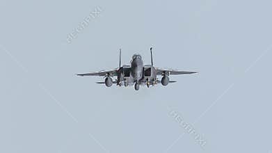 NATO USAF F15 fighter jet in flight flying straight towards the camera