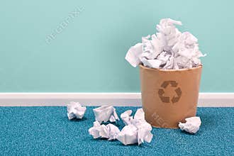 Recycle waste paper basket on office floor