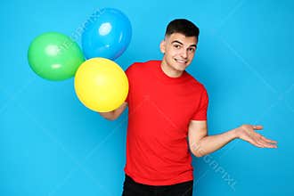 Yuong man with balloons