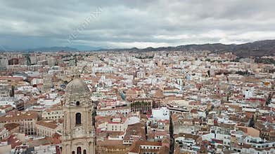 Panoramic aerial view of Malaga City. Drone passing cinematic close to Cathedral
