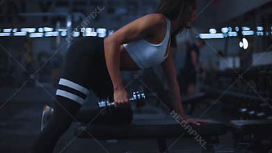 Muscular black fitness sports woman workout with barbell in fitness gym.