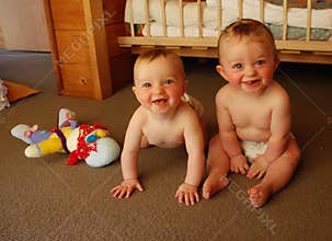Baby twins in bedroom
