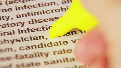 Macro shot of the word `avian flu` highlighted with a yellow marker