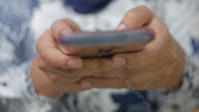 Close up of woman holding and using smart mobile phone, scrolling browsing internet on gadget