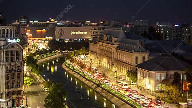 Bucharest timelapse traffic in the city centre , cars on the street and modern buildings