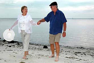 Happy senior couple on beach